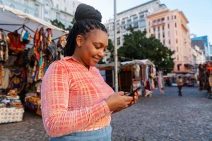 women in kenya using a financed smartphone