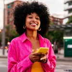 Happy women with Financed Phone in Africa (1)