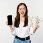 woman-showing-mobile-phone-screen-cash-money-concept-microcredit-bank-loans-standing-white-background